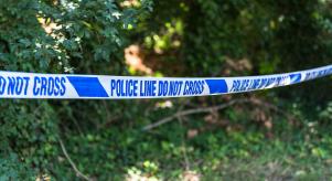 Police tape in a park