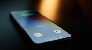 A smartphone lighting up as it receives a phone call
