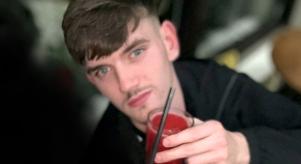 Tyler Kerry holding a red drink