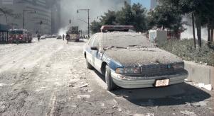 A NYPD car covered in debris and ash, following the 9/11 terrorist attacks