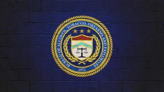 The ATF (Bureau of Alcohol, Tobacco, Firearms and explosives) logo painted on a brick wall.