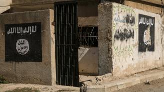 Logos written by ISIS fighters on the walls