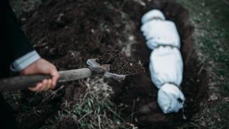 Burying a body in a shallow grave