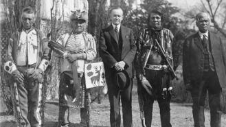 Four Osage men with U.S president Calvin Coolidge