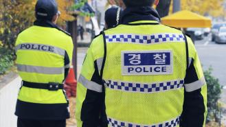 Three South Korean policemen on patrol