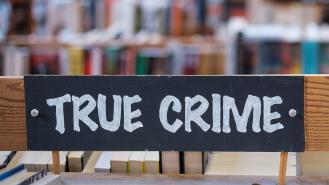 A 'true crime' sign in a library