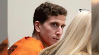 Bryan Kohberger looks toward his attorney during a hearing