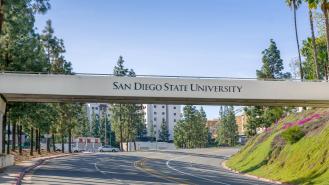 A bridge over a road that reads 'San Diego State University'