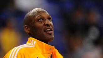 NBA star Lamar Odom wearing a LA Lakers tracksuit jacket