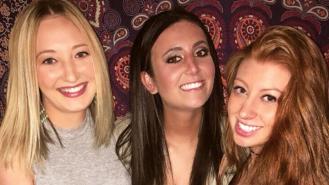 Samantha Josephson (C) smiles with two friends