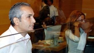 Suspect Mohammed M'Barek and his sister Jamila stand at the start of his trial in a Nice courthouse