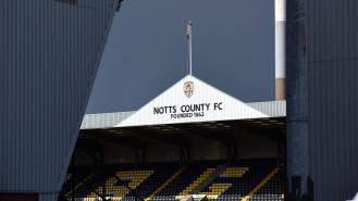 Notts County's home stadium. An image of one of the stands with 'NOTTS COUNTY FC - FOUNDED 1862' written on top of it