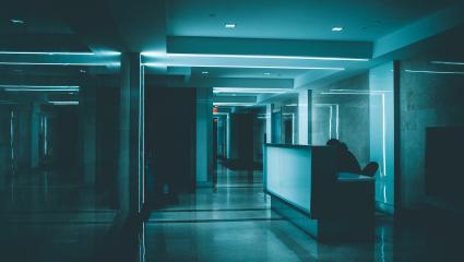 A low-lit hospital reception at night