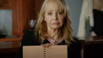 Former Playboy Bunny Susanne Singer showing the camera list of rules in a book