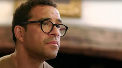 Raphael Rowe listening intently