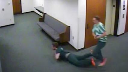 CCTV footage of two convicts running through a corridor and one has fallen over
