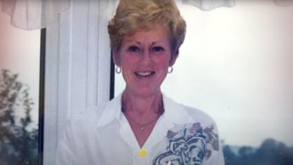Family photo of Wendy Speakes holding a birthday cake