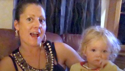Christine Chambers holding her two-year-old daughter