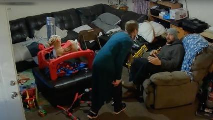 Woman shouting at her husband next to children's toys