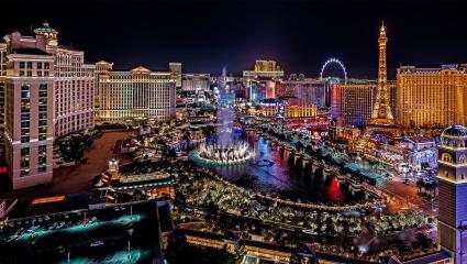An elevated nighttime panoramic view of the colourful LAs Vegas skyline