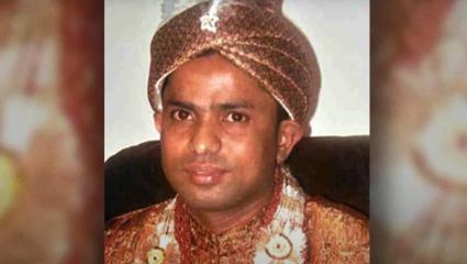 Family photo of Muhammad Amin Miah in traditional Bangladeshi dress