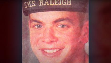 Nicholas Wright wearing a 'HMS Raleigh' Royal Navy hat