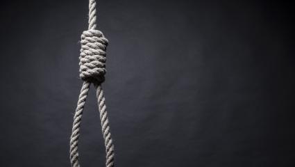 A photograph of gallows on a black background