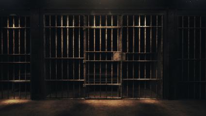 A stock photo of a dark prison cell