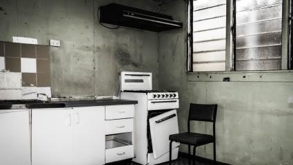 A stock photo of an old run down kitchen.