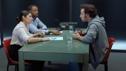 Two detectives interrogating a suspect