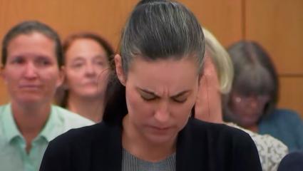 Ashely McArthur lowers her head in court