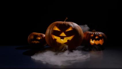 Menacing Halloween pumpkins surrounded by smoke