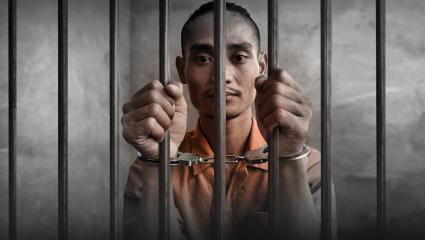 60 Days In: The Jail key art featuring a prisoner in handcuff holding onto cell bars