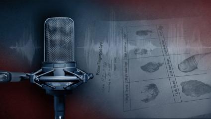A broadcast microphone in front of a crime scene where police take a record of a person's fingerprints
