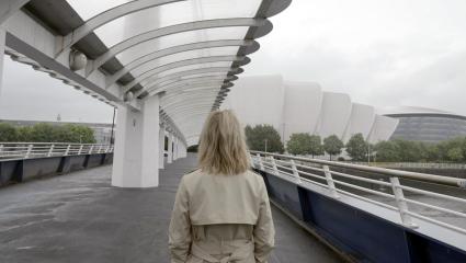 Emilia Fox facing away from camera in front of the Clyde Auditorium (SEC Armadillo)