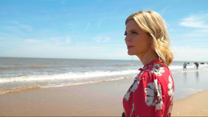 Emilia Fox standing on Mablethorpe beach