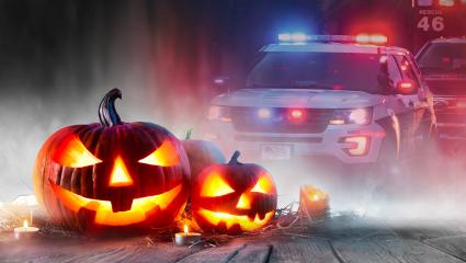 Halloween pumpkins with a smoke background and a US police car photo montage