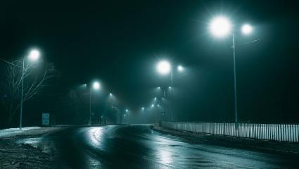 A stock photo showing street lights in the fog