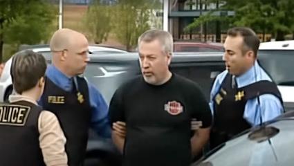 Drew Peterson being led away by police