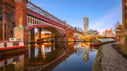 View of Manchester tallest building Beetham Tower, reflecting in Manchester Canal.
