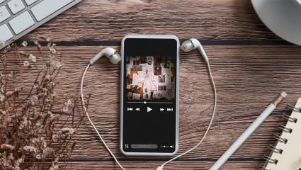 A smartphone playing a true crime podcast