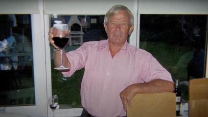David Jackson raising a glass of red wine