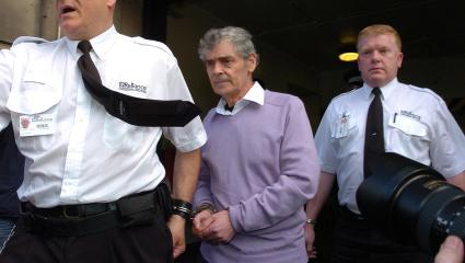 Peter Tobin being led away by police
