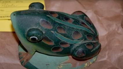 A decorative stone frog