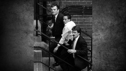 Kenneth Erskine being led up some stairs by two detectives