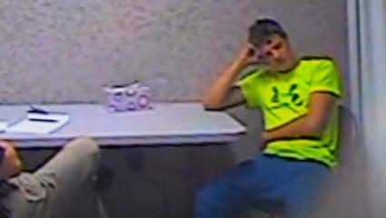 Spencer Spielman looking tired in the interrogation room