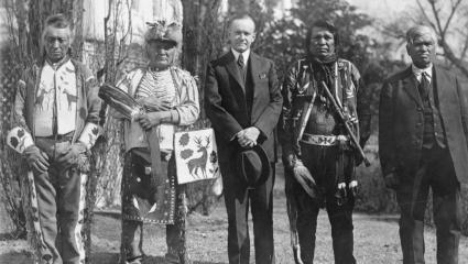 Four Osage men with U.S president Calvin Coolidge