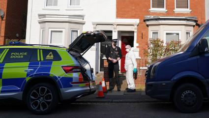 Police cars outside the crime scene at Nicholas Billingham's home
