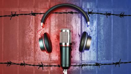 A graphic showing headphones and a microphone in front of a prison cell
