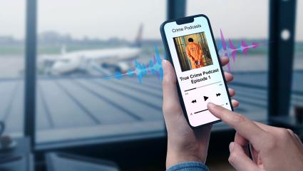 Listening to a true crime podcast at the airport